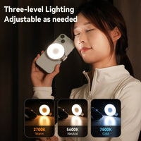 Person using a phone with a ring light, showing three-level lighting options. telesen emirazaar