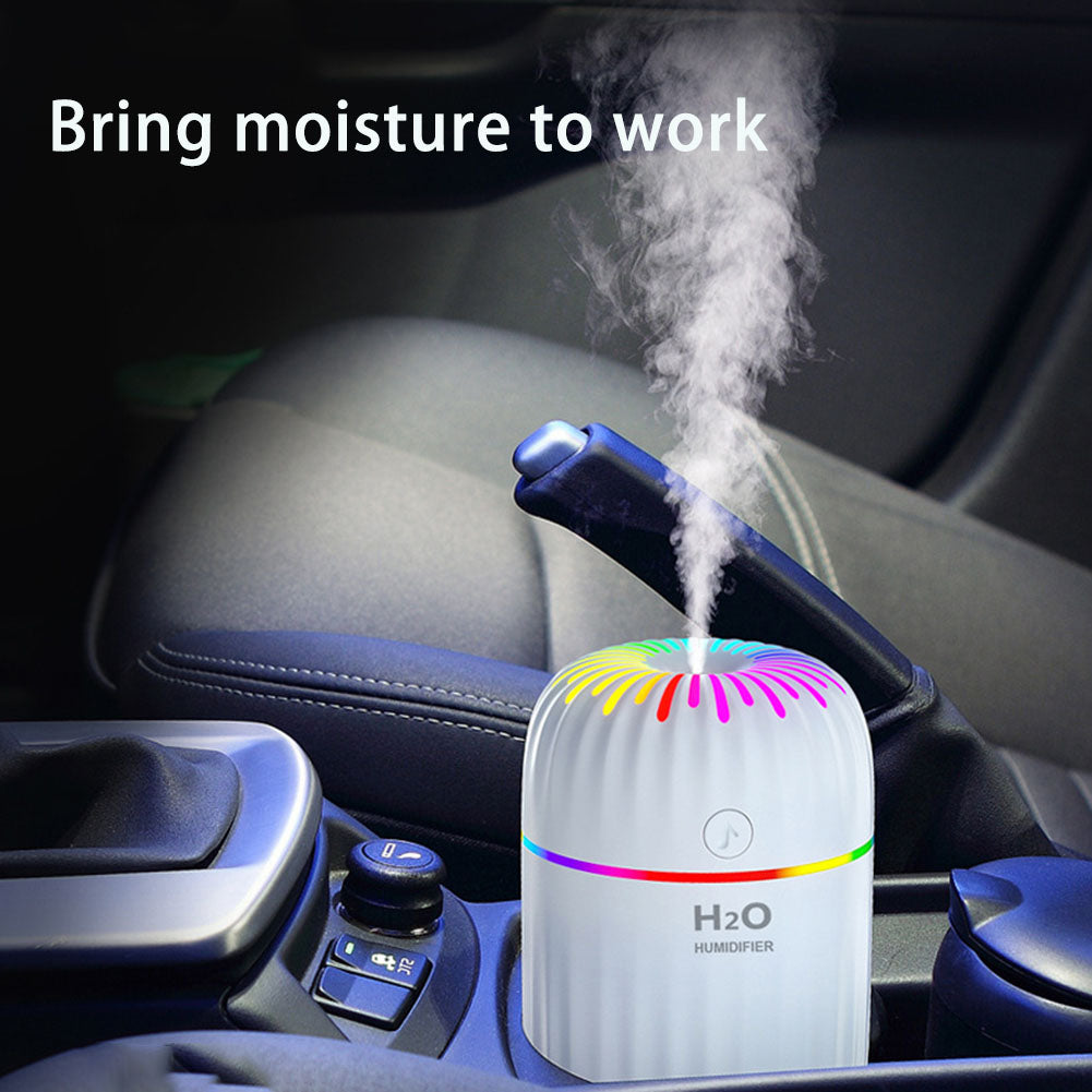 Car humidifier emitting steam with 'Bring moisture to work' text above, placed on a car's console.