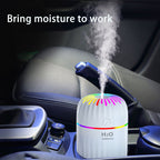 Car humidifier emitting steam with 'Bring moisture to work' text above, placed on a car's console.
