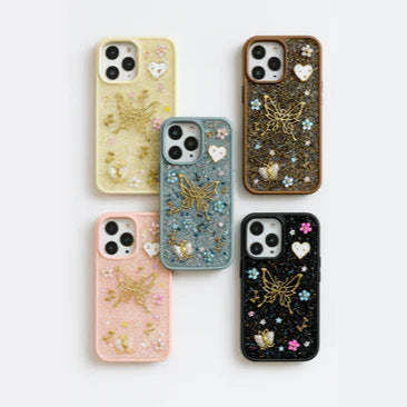 Set of six decorated phone cases on a white background