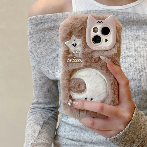 Person holding a fluffy phone case with a cat design