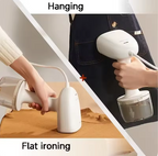 Handheld steamer being used for hanging and flat ironing on a white background.