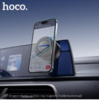 Smartphone mounted on a car dashboard using a magnetic holder with 'hoco.' branding.