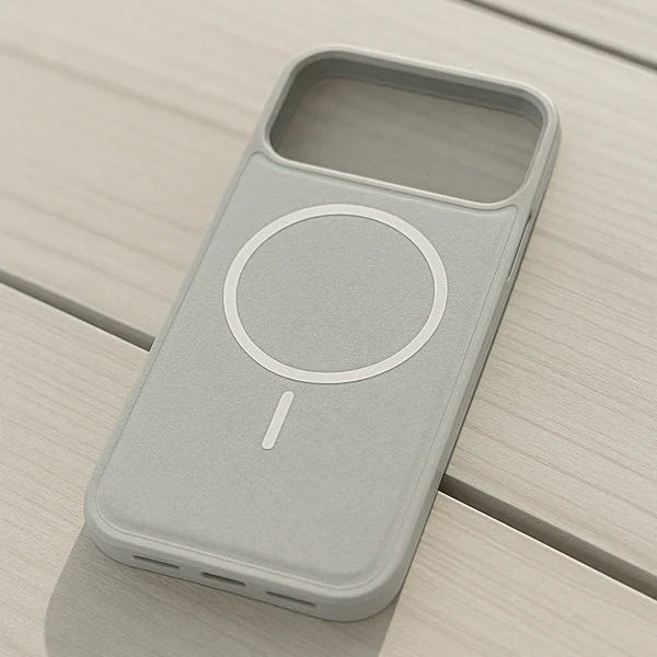 Gray phone case with a circular design on a wooden surface