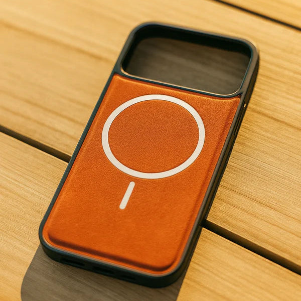 Phone case with a brown leather patch and white circular design on a wooden surface