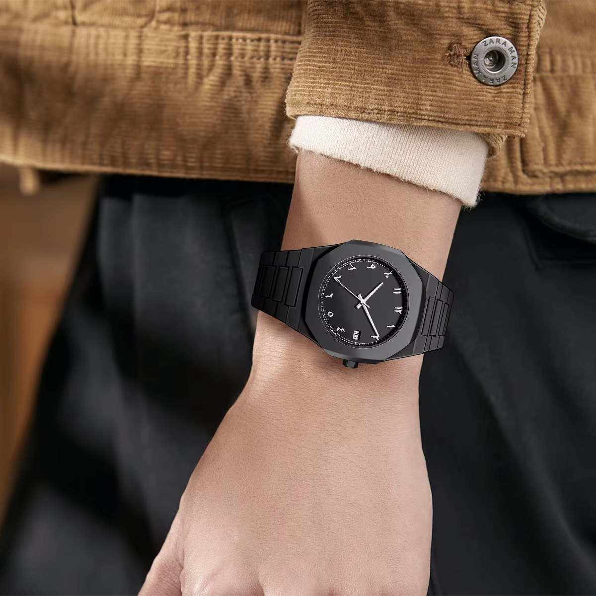 Black watch on a wrist with a blurred background