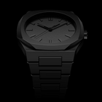 Black wristwatch with a dark background