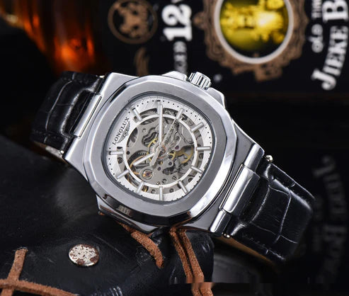 Luxury watch with black leather strap on a dark background