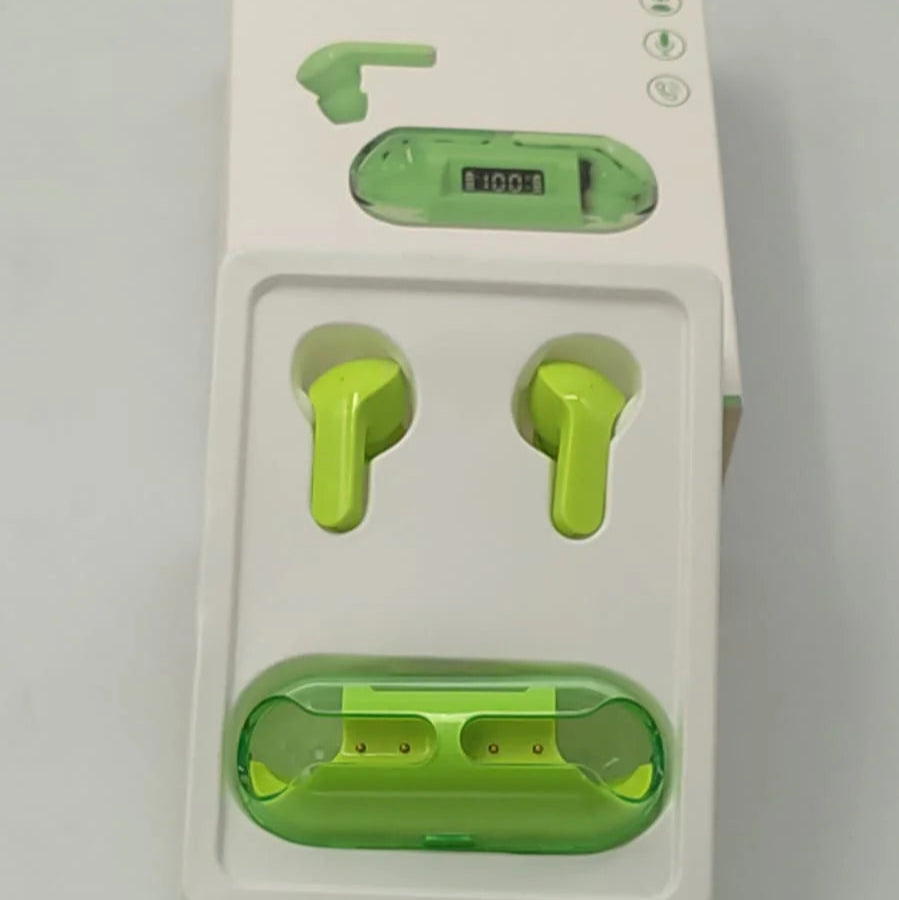 Green earbuds in a white packaging with a USB cable on a gray background