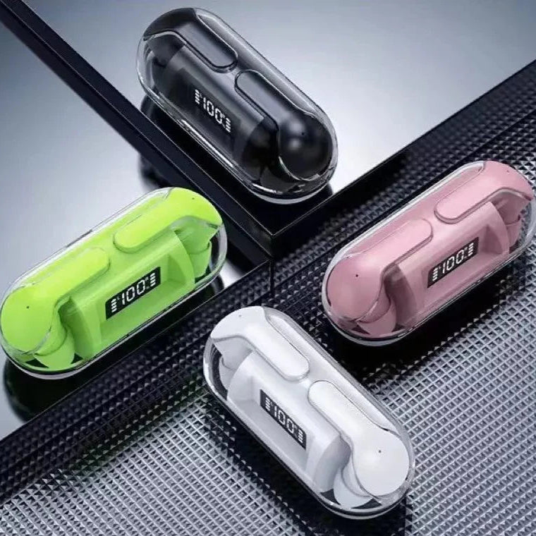 Four wireless earbuds in different colors with charging cases on a textured surface.