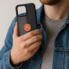 Person holding a phone case with a logo on a plain background